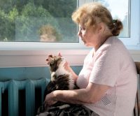 older woman with cat